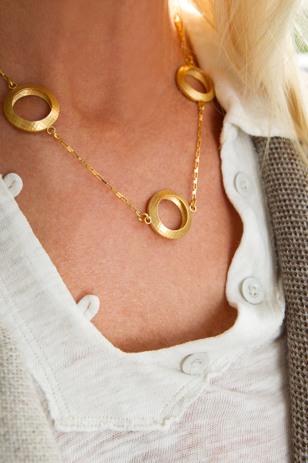 Model wearing Pareure 360º Series Large 18k Yellow Gold Vermeil Trio Necklace